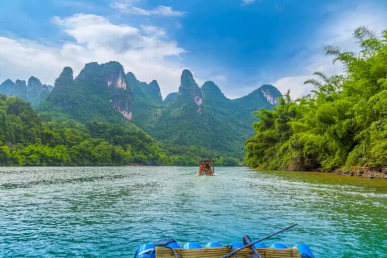 tropical water with green trees on each side