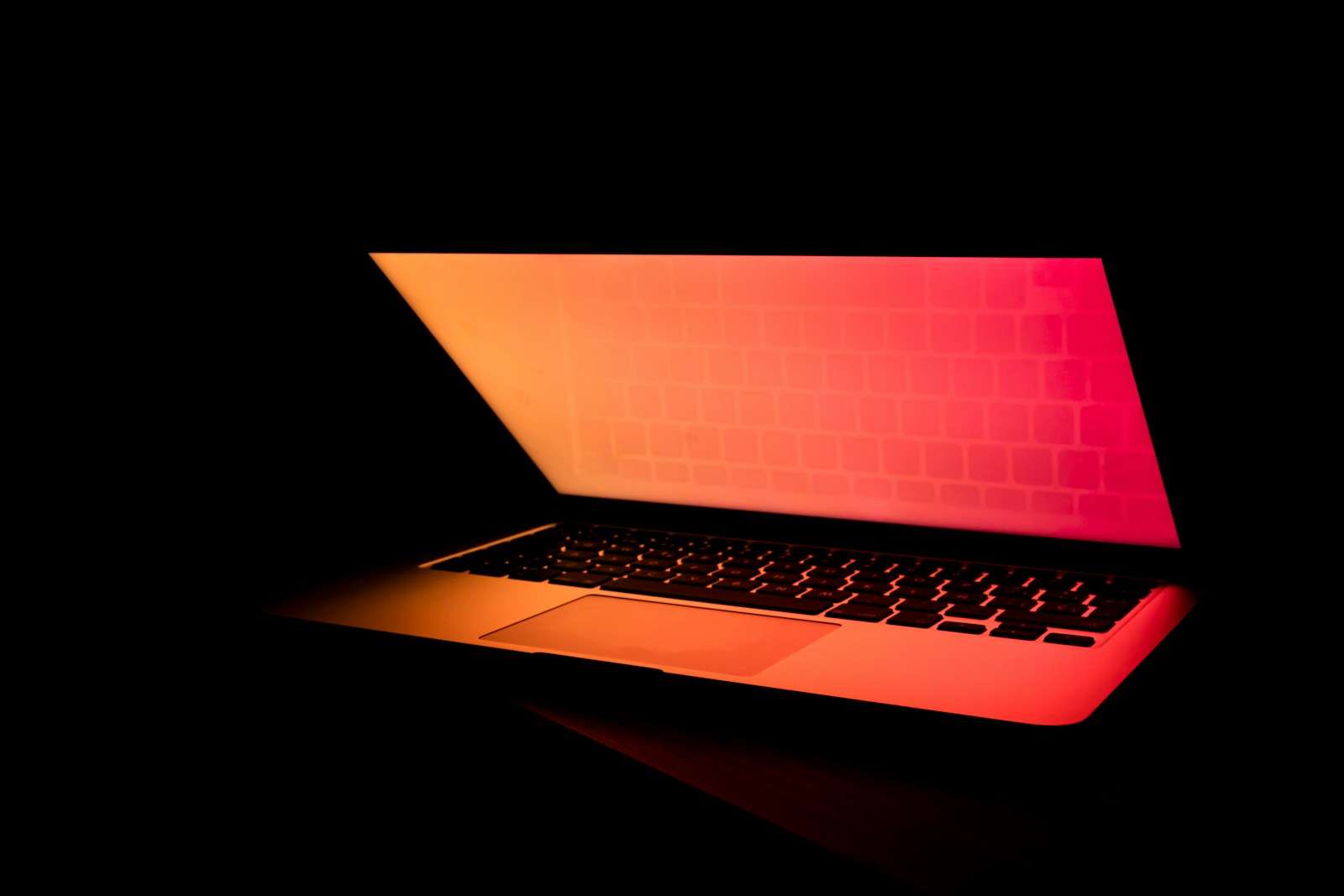 turned-on laptop computer red screen data breach