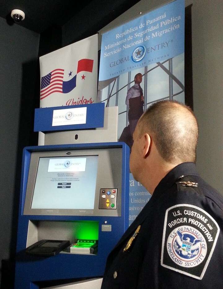 global entry kiosk with police officer