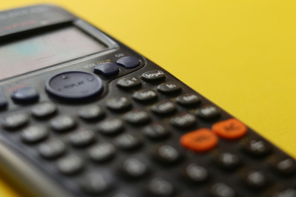 black calculator on yellow background